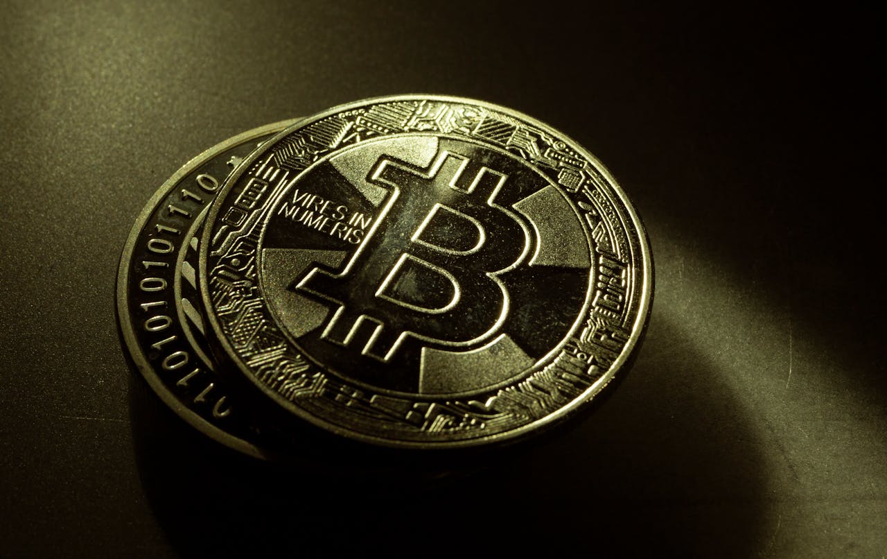 Detailed shot of a Bitcoin coin with a digital texture highlighting its cryptocurrency design.